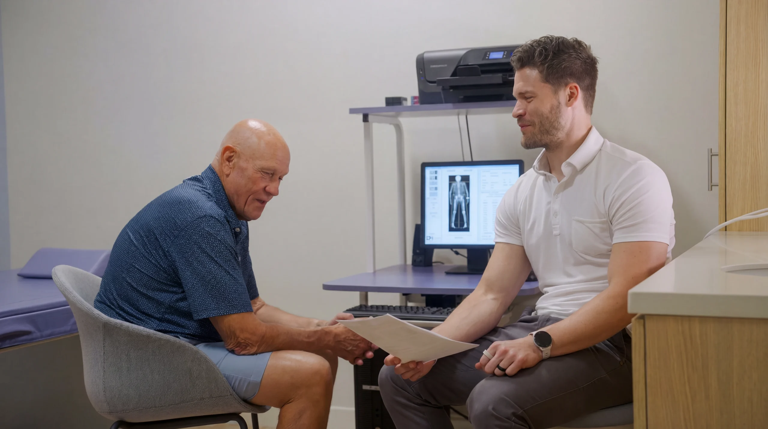True Health clinician reviewing DEXA scan body composition results with a patient at the Deerfield, IL concierge medicine office